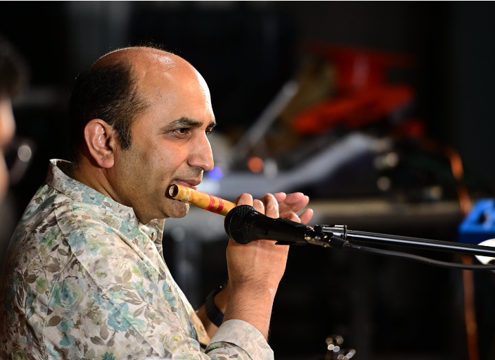 Krishna playing the Carnatic flute